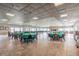 Community Center featuring spacious open layout with tiled floors, and a fireplace at 7 Elgin Pl # 202, Dunedin, FL 34698