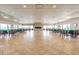 Community Center featuring spacious open layout with tiled floors, fireplace, and window views at 7 Elgin Pl # 202, Dunedin, FL 34698