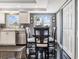 Well-lit kitchen area with practical layout, dark tile floors, eat in area and lots of storage at 7 Elgin Pl # 202, Dunedin, FL 34698