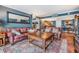 Inviting living room with leather furniture, decorative rug, and an open layout with lots of light at 7 Elgin Pl # 202, Dunedin, FL 34698