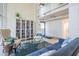 Inviting lobby area showcases a cozy seating area with a bookshelf, decorative rug, and comfortable seating at 7 Elgin Pl # 202, Dunedin, FL 34698