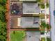 Aerial view highlighting property lines and lot layout in a suburban neighborhood with play area at 7034 Emerald Spring Loop, New Port Richey, FL 34653