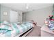 Charming bedroom with soft colors, closet, and cozy decor creates a relaxing atmosphere at 7034 Emerald Spring Loop, New Port Richey, FL 34653