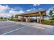Community mailbox structure in parking area, providing a convenient and secure mail service for residents at 7034 Emerald Spring Loop, New Port Richey, FL 34653