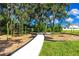 Community playground with modern play structures and a swing set, perfect for Gathering fun and recreation at 7034 Emerald Spring Loop, New Port Richey, FL 34653