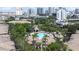 Serene aerial view of community pool with lush landscaping, resort style living, and inviting recreational space at 731 Cruise View Dr, Tampa, FL 33602