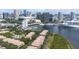 Fantastic aerial view of waterfront condos with bay access and Tampa skyline, offering serene city living at 731 Cruise View Dr, Tampa, FL 33602