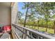 Balcony with decorative railing overlooking verdant scenery and neighborhood at 731 Cruise View Dr, Tampa, FL 33602