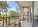 This beautiful balcony has furniture and a view of the greenery surrounding the property at 731 Cruise View Dr, Tampa, FL 33602