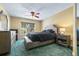 Comfortable bedroom offers a ceiling fan, natural light from the window, and a calm atmosphere for rest and relaxation at 731 Cruise View Dr, Tampa, FL 33602