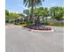 Charming community entrance featuring meticulous landscaping, guard house, and clear signage for Island Walk Condominiums at 731 Cruise View Dr, Tampa, FL 33602