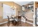 Cozy dining area features a round table with chandelier lighting and staircase access, perfect for entertaining and everyday living at 731 Cruise View Dr, Tampa, FL 33602