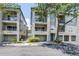 Three-story condo building features balconies, attached garages, green space and mature trees at 731 Cruise View Dr, Tampa, FL 33602