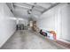 Spacious garage with ample storage cabinets, washer, dryer and concrete flooring at 731 Cruise View Dr, Tampa, FL 33602
