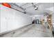 Large garage featuring built-in storage cabinets, laundry area, and epoxy floor at 731 Cruise View Dr, Tampa, FL 33602