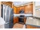 Well-equipped kitchen boasts stainless steel appliances, ample cabinetry, and modern countertops for a functional and stylish cooking space at 731 Cruise View Dr, Tampa, FL 33602