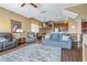 Comfortable living room features wood floors, access to the kitchen and dining area, and high ceilings at 731 Cruise View Dr, Tampa, FL 33602