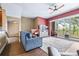 Bright living room featuring a sliding glass door to the balcony and a ceiling fan at 731 Cruise View Dr, Tampa, FL 33602