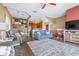 Open-concept living room with a staircase and a view of the adjacent kitchen and dining area at 731 Cruise View Dr, Tampa, FL 33602
