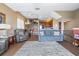 Open-concept living room and kitchen features a staircase to the upper level and a dining area at 731 Cruise View Dr, Tampa, FL 33602