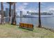 Picturesque waterfront with a bench, palm trees, and a clear view of a cruise ship at 731 Cruise View Dr, Tampa, FL 33602