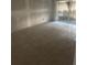 Large room with a door leading to the outside at 7522 Needle Leaf Pl # 28, Tampa, FL 33617