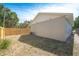 Backyard with a wooden fence, air conditioning unit, and lawn at 7551 52Nd N St, Pinellas Park, FL 33781