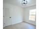 Bright bedroom with a modern ceiling fan, neutral walls, and natural light from a large window at 7551 52Nd N St, Pinellas Park, FL 33781