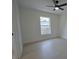 Bright bedroom with a ceiling fan and a large window bringing in natural light at 7551 52Nd N St, Pinellas Park, FL 33781