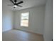 Bright bedroom with a ceiling fan and a large window bringing in natural light at 7551 52Nd N St, Pinellas Park, FL 33781
