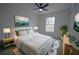 Bedroom with a large bed, nightstands, and a large window with natural light at 7551 52Nd N St, Pinellas Park, FL 33781