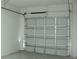 Spacious garage featuring large garage door and ample space for storage at 7551 52Nd N St, Pinellas Park, FL 33781