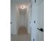 Bright hallway with white walls, light wood floors, and modern lighting fixtures at 7551 52Nd N St, Pinellas Park, FL 33781