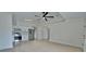 Open living space with modern kitchen, bright lighting, and sleek stainless steel appliances at 7551 52Nd N St, Pinellas Park, FL 33781