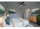 Relaxing main bedroom with decor art, a ceiling fan, and an ensuite bathroom entrance at 7551 52Nd N St, Pinellas Park, FL 33781