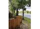 View of the back patio featuring a pond with a fountain and a wood privacy fence at 7616 Colonial Ct, Tampa, FL 33615
