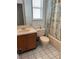 Bathroom featuring a single sink vanity, toilet and tub with shower at 7616 Colonial Ct, Tampa, FL 33615