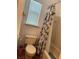 Bathroom featuring a toilet, tub with shower, and a small window at 7616 Colonial Ct, Tampa, FL 33615