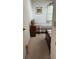 Bedroom with two beds, an adjacent window, and a decorative cat statue at 7616 Colonial Ct, Tampa, FL 33615