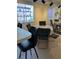 The dining area features a table with chairs and a mirror that enhances the space at 7616 Colonial Ct, Tampa, FL 33615