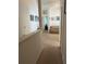 Upstairs hallway showing access to bedrooms and Gathering room at 7616 Colonial Ct, Tampa, FL 33615