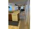 Open kitchen with dishwasher offering a view of the dining and living areas at 7616 Colonial Ct, Tampa, FL 33615