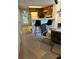 Efficient kitchenette with bar seating and access to an outdoor area at 7616 Colonial Ct, Tampa, FL 33615