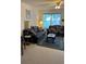 Comfortable living room with two sofas, coffee table, and ample natural light at 7616 Colonial Ct, Tampa, FL 33615