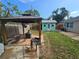 Relaxing outdoor space with a gazebo, patio, and shed surrounded by green grass at 7920 52Nd N St, Pinellas Park, FL 33781