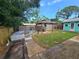 Spacious backyard featuring a gazebo with outdoor seating, a decorative well, and mature landscaping at 7920 52Nd N St, Pinellas Park, FL 33781