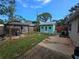 The backyard features a cozy gazebo, a shed, and a patio area, enclosed by a wooden fence at 7920 52Nd N St, Pinellas Park, FL 33781