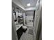 A compact bathroom featuring a vanity, decorative tiled floors, and shower-tub combo at 7920 52Nd N St, Pinellas Park, FL 33781