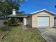 Charming single-story home with a well-maintained lawn and attached one car garage at 7920 52Nd N St, Pinellas Park, FL 33781