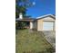 Charming single-story home with a well-maintained lawn and attached one car garage at 7920 52Nd N St, Pinellas Park, FL 33781